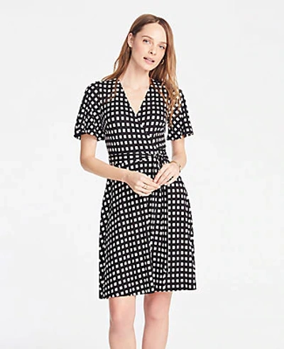 Shop Ann Taylor Petite Shadowed Square Flutter Sleeve Wrap Dress In Black