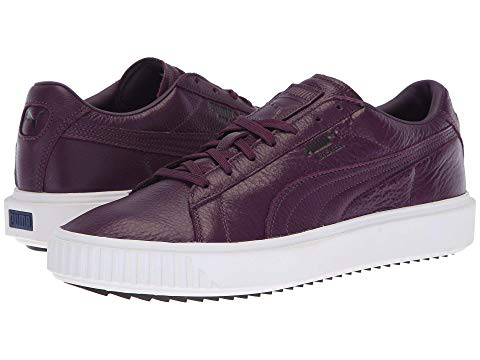 purple and white puma sneakers