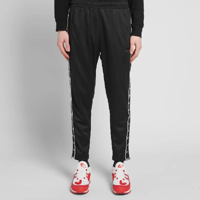 Nike Taped Poly Track Pant In Black | ModeSens