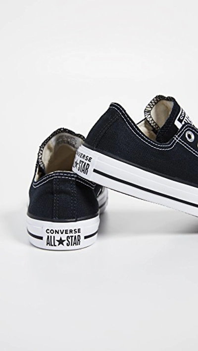 Shop Converse Chuck Taylor All Star Slip On Sneakers In Black/white