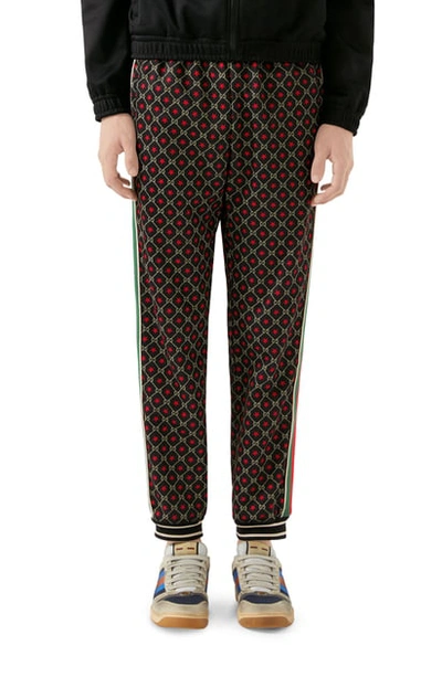 Shop Gucci Gg Star Print Technical Jersey Jogger Pants In Black/ Yard/ Live Red