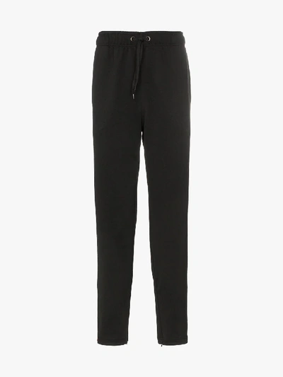 Shop Burberry Icon Stripe Detail Jersey Trackpants In 1002 Black