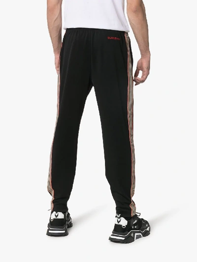 Shop Burberry Icon Stripe Detail Jersey Trackpants In 1002 Black