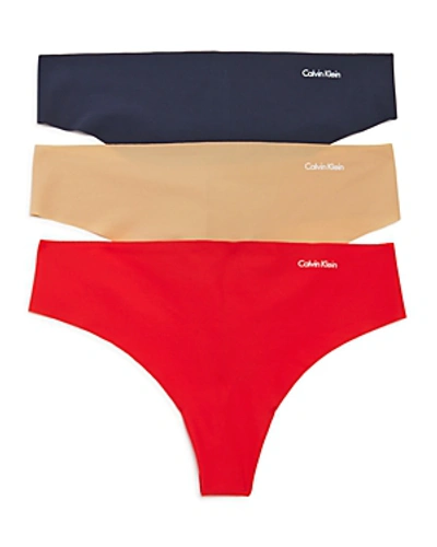 Shop Calvin Klein Invisibles Thongs, Set Of 3 In Bare/fire Lily/speakeasy