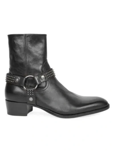 Shop Saint Laurent Wyatt Studded Leather Boots In Black