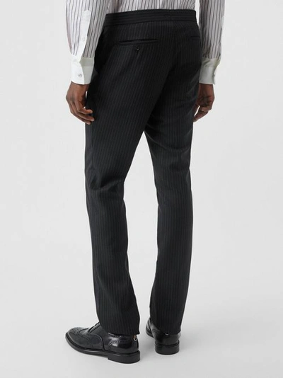 Shop Burberry Classic Fit Pinstriped Wool Tailored Trousers In Black