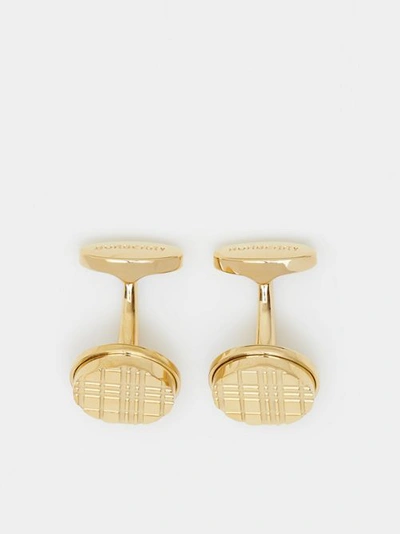 Shop Burberry Gold-plated Check-engraved Round Cufflinks In Light Gold