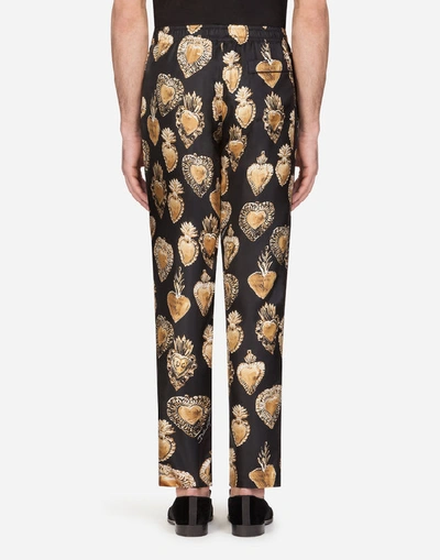 Shop Dolce & Gabbana Silk Pajama Pants With Sacred Heart Print In Black