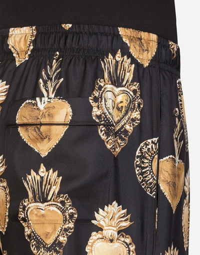 Shop Dolce & Gabbana Silk Pajama Pants With Sacred Heart Print In Black