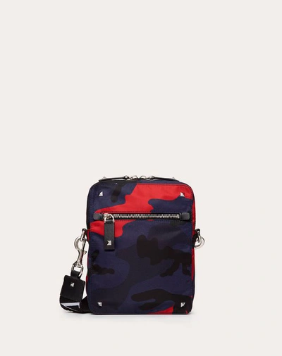 Shop Valentino Garavani Uomo Camouflage Small Nylon Shoulder Bag With Vltn Ribbon Strap In Navy/ Red