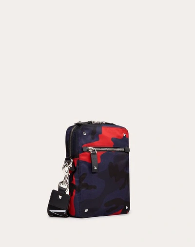 Shop Valentino Garavani Uomo Camouflage Small Nylon Shoulder Bag With Vltn Ribbon Strap In Navy/ Red