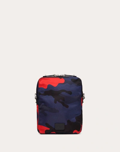 Shop Valentino Garavani Uomo Camouflage Small Nylon Shoulder Bag With Vltn Ribbon Strap In Navy/ Red