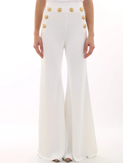 Shop Balmain Embellished Flared Trousers In White