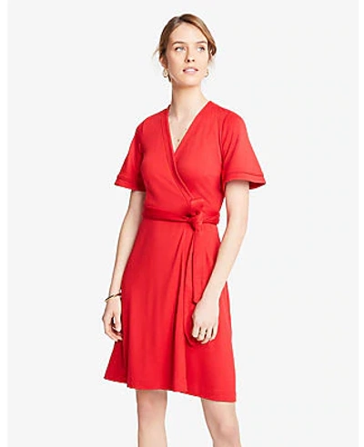 Shop Ann Taylor Petite Piped Flutter Sleeve Wrap Dress In Real Red