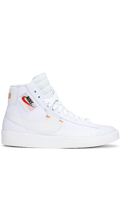 Shop Nike Women's Blazer Mid Rebel Sneaker In White & Orange