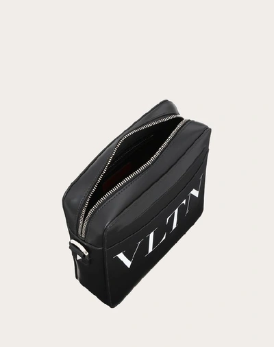 Shop Valentino Garavani Uomo Small Leather Vltn Crossbody Bag In Black/white