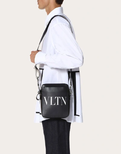 Shop Valentino Garavani Uomo Small Leather Vltn Crossbody Bag In Black/white
