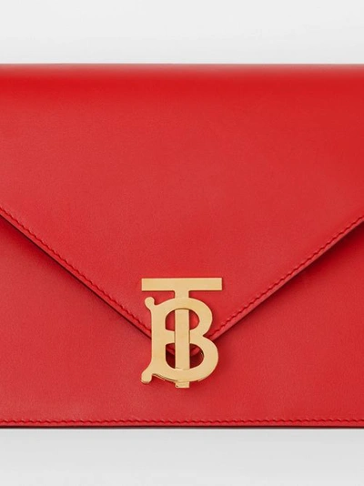 Shop Burberry Small Leather Tb Envelope Clutch In Bright Military Red