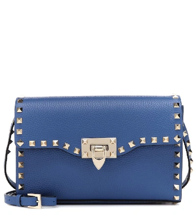 Shop Valentino Rockstud Small Leather Crossbody Bag In Blue