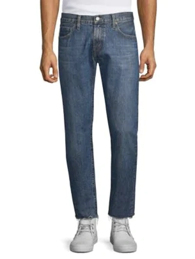 Shop J Brand Eli Tapered Skinny Jeans In Medium Blue