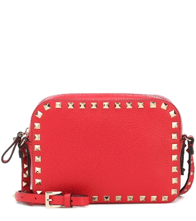 Shop Valentino Rockstud Leather Crossbody Bag In Red
