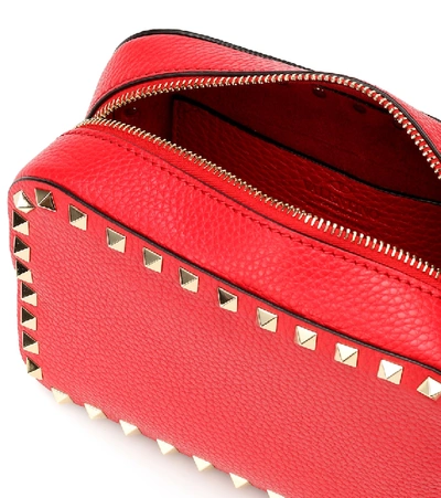 Shop Valentino Rockstud Leather Crossbody Bag In Red