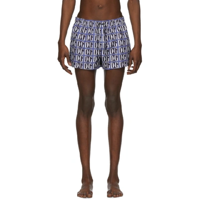 Shop Dolce & Gabbana Dolce And Gabbana Blue And White Dg Graphic Swim Shorts In Hby43blue