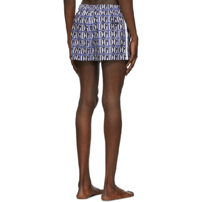 Shop Dolce & Gabbana Dolce And Gabbana Blue And White Dg Graphic Swim Shorts In Hby43blue