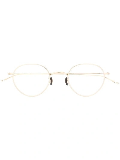 Shop Eyevan7285 Round Frame Glasses In Gold