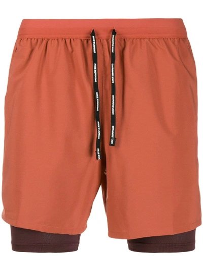 Shop Nike Short Layered Shorts - Brown