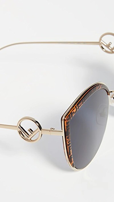 Shop Fendi Logo Trim Cat Eye Sunglasses In Gold