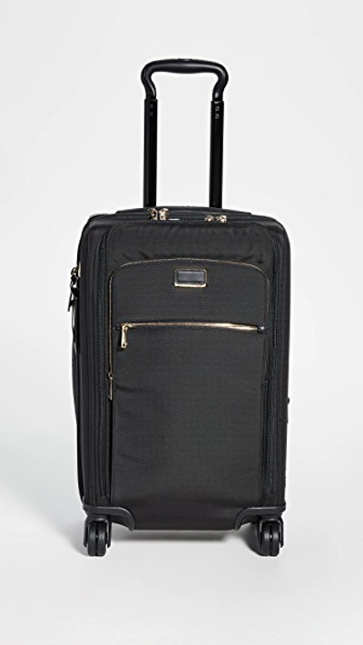 Shop Tumi Sutter International Suitcase In Black/gold