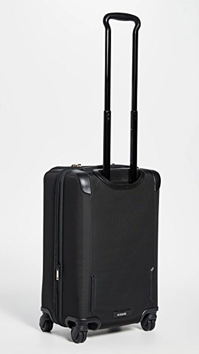 Shop Tumi Sutter International Suitcase In Black/gold