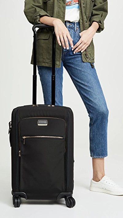 Shop Tumi Sutter International Suitcase In Black/gold