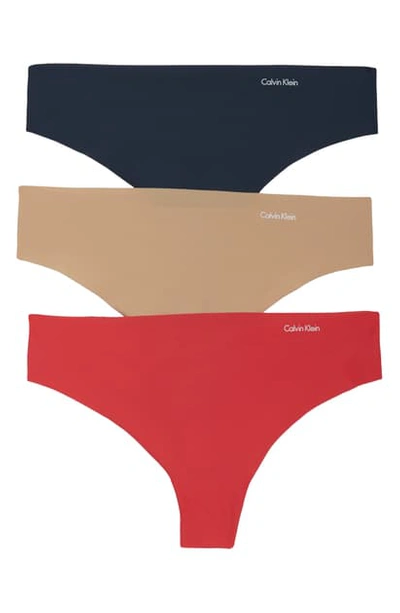 Shop Calvin Klein Invisibles Thong In Bare/ Fire Lily/ Speakeasy