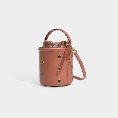 Shop Coach Grommets Drawstring Bucket Bag In Pink Calfskin