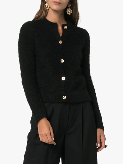 Shop Versace Gold Tone Button Knitted Cardigan In 101 - Black