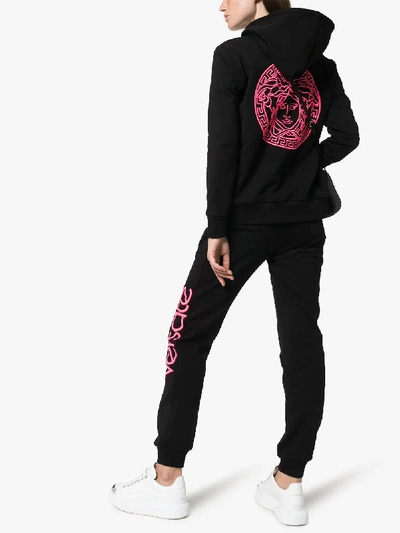 Shop Versace Logo Print Cotton Sweatpants In Black