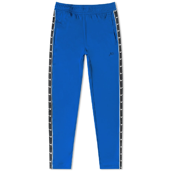 Nike Taped Poly Track Pant In Blue | ModeSens