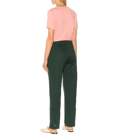 Shop Acne Studios Face Cotton-blend Trackpants In Green