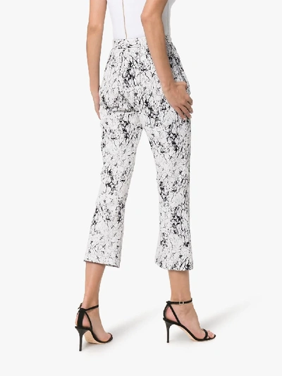Shop Balmain High Waisted Cracked Cotton Jersey Trousers In Gab White