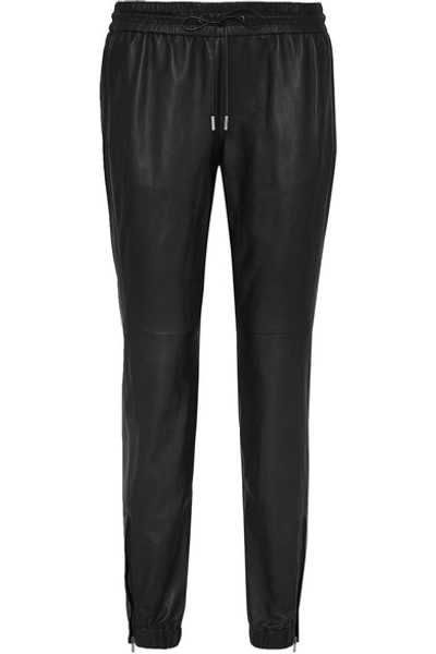 Shop Saint Laurent Tapered Leather Pants In Black