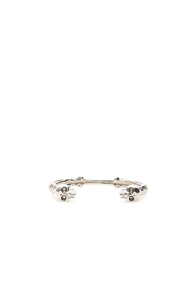 Shop Alexander Mcqueen Textured Double Skull Bracelet In Silver (silver)