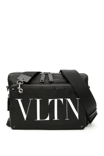 Shop Valentino Vltn Messenger Bag In Nero Bianco (black)