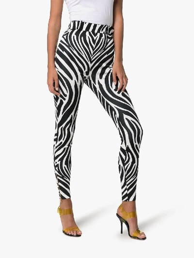 Shop Versace Stripe Print Trousers In Black