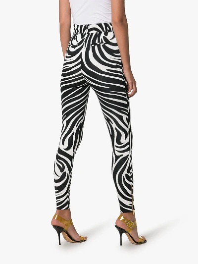 Shop Versace Stripe Print Trousers In Black