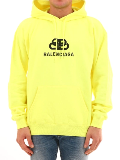 Shop Balenciaga Logo Drawstring Hoodie In Yellow