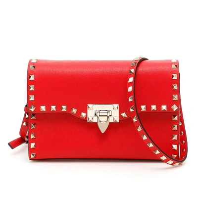 Shop Valentino Garavani Small Rockstud Shoulder Bag In Red