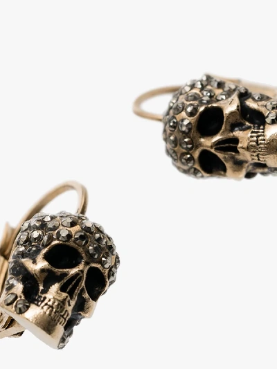 Shop Alexander Mcqueen Gold-tone Crystal Skull Earrings In Metallic