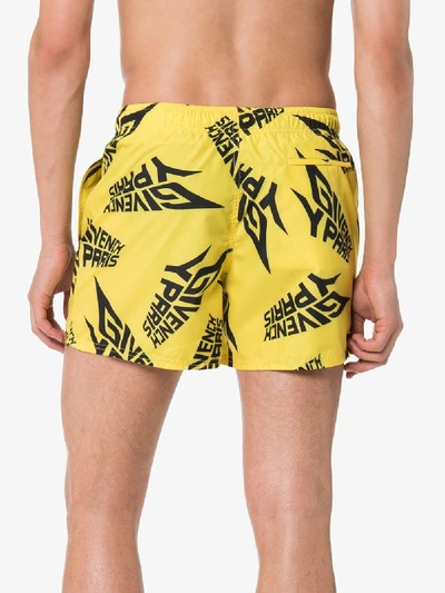 Shop Givenchy Logo Print Swim Shorts In Yellow